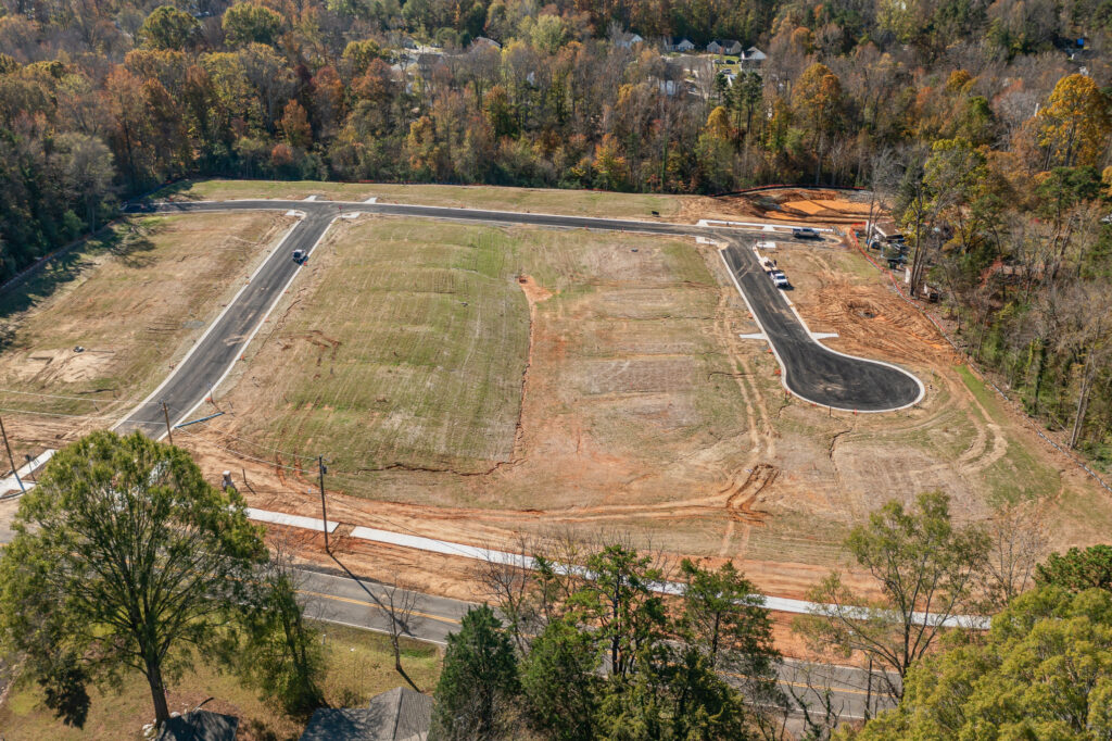 Pines at Paw Creek, cost-effective residential floor plan, Red Cedar Construction team meeting, construction site photo
