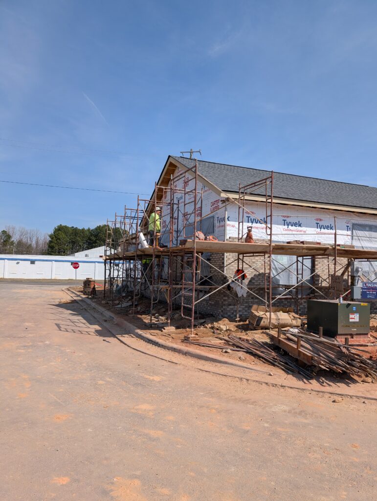 Rankin, residential construction company leaders, Red Cedar Construction team meeting, construction company directory listing